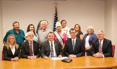 AG Schmidt and Kickapoo Tribe representatives signed a new Water Rights Settlement Agreement